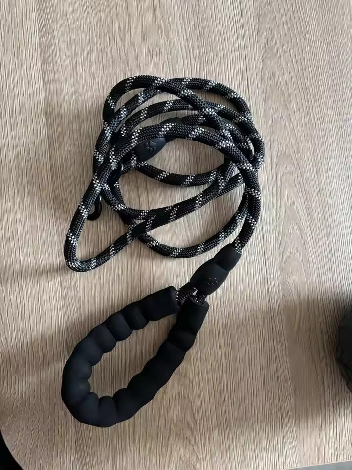 Black and gray rope on a wooden surface