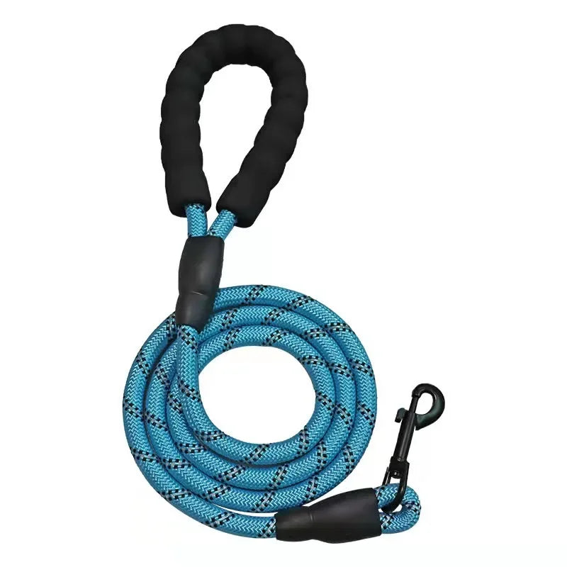 Blue dog leash with black handle and clip on a white background