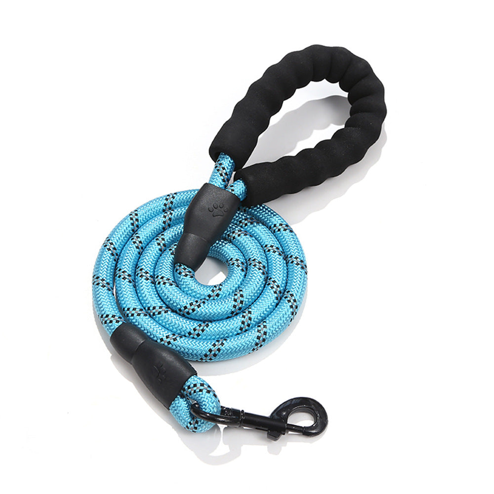 Blue dog leash with black handle and clip on a white background