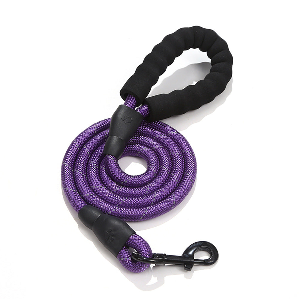 Purple dog leash with black handle on a white background
